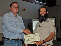 Hein van Kralingen (left) receives the award from APGA President Scott Clark at the AGM held in Macksville in August 2012